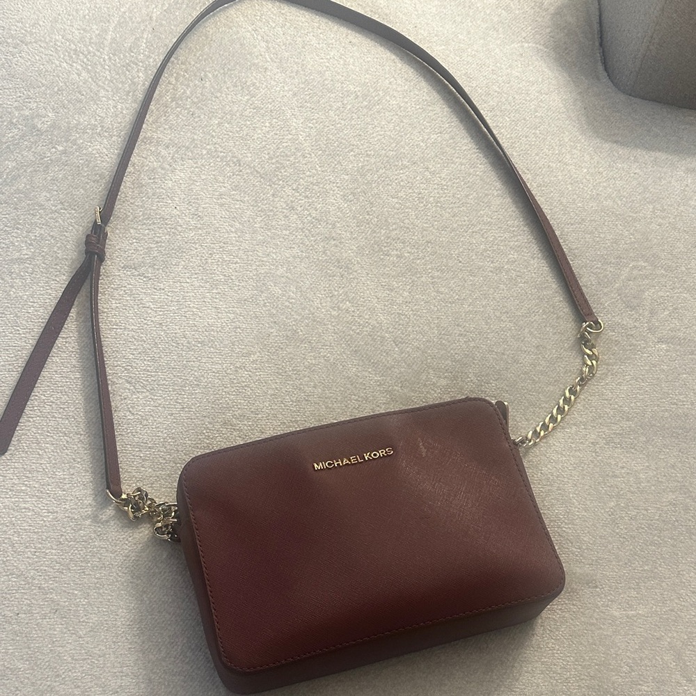 Burgundy Michael Kors crossbody bag